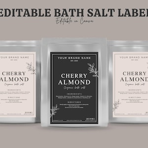 May include: Three clear pouches of bath salts with labels. The labels read "Cherry Almond Organic bath salt" with ingredient and direction details. The text "Editable Bath Salt Label" is at the top.
