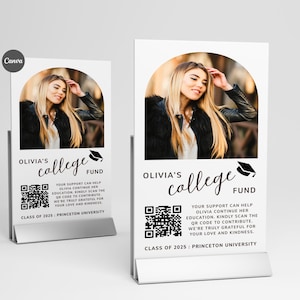 May include: Two white table signs with a photo of a woman, the text "Olivia's College Fund", a QR code, and text about supporting her education. The signs are in a silver metal holder. The text also includes "Class of 2025: Princeton University."