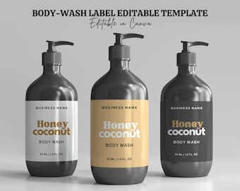 May include: Three black bottles of body wash with white labels. The labels have the text "Honey coconut" in orange and the text "Body Wash" in black. The bottles are 30 ml or 1.0 fl oz.