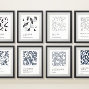以下が含まれることがあります： 白地に黒と青の抽象的なパターンが描かれた、黒の額縁に入ったプリントが8枚。各プリントの下には、「インスピレーション」、「リーダーシップ」、「成功」、「感謝」、「粘り強さ」、「粘り強さ」、「決意」、「一貫性」などの言葉が書かれています。