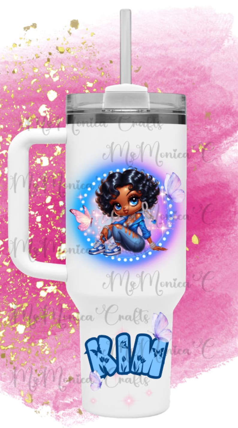 May include: White handled tumbler with a cartoon girl illustration, dark curly hair, blue clothing, and butterflies. The tumbler has a clear lid and a straw. The name "Kim" is written in blue graffiti style.