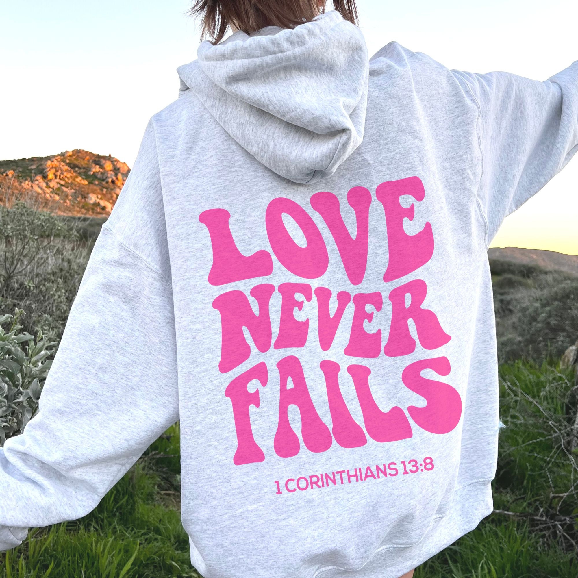 Love Never Fails Christian Hoodie - Fabrics Of Faith