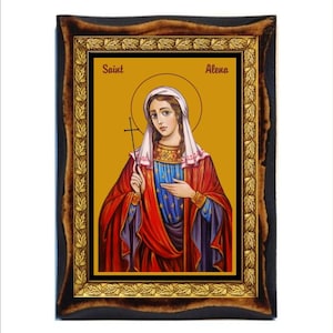 Könnte beinhalten: Eine gerahmte religiöse Ikone, die die Heilige Alena darstellt, eine Frau in einem roten und blauen Gewand, die ein Kreuz hält. Die Ikone hat einen goldenen Hintergrund und einen dekorativen Rahmen mit einem Blattmotiv.