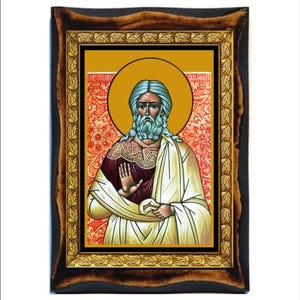 May include: A framed icon depicting a bearded man with a halo, wearing a white robe and a burgundy tunic. The icon has a gold frame with a leaf design and a red background with floral patterns.