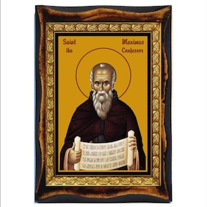 May include: Icon of Saint Maximus the Confessor, featuring a portrait of an elderly man with a white beard and a halo. The image is framed in a dark wood frame with a gold inner border and a yellow background.
