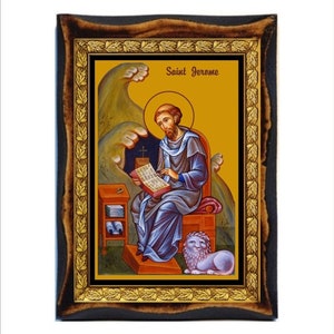 May include: A framed icon of Saint Jerome, depicted in a blue robe, reading a book. He is seated on a throne with a lion at his feet. The icon has a gold background and a wooden frame.
