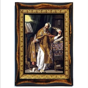 May include: Framed religious artwork showing a robed figure with a halo, holding a quill and a flaming heart. The painting features a detailed interior scene with books and a patterned tablecloth. The frame is dark with a gold leaf border.