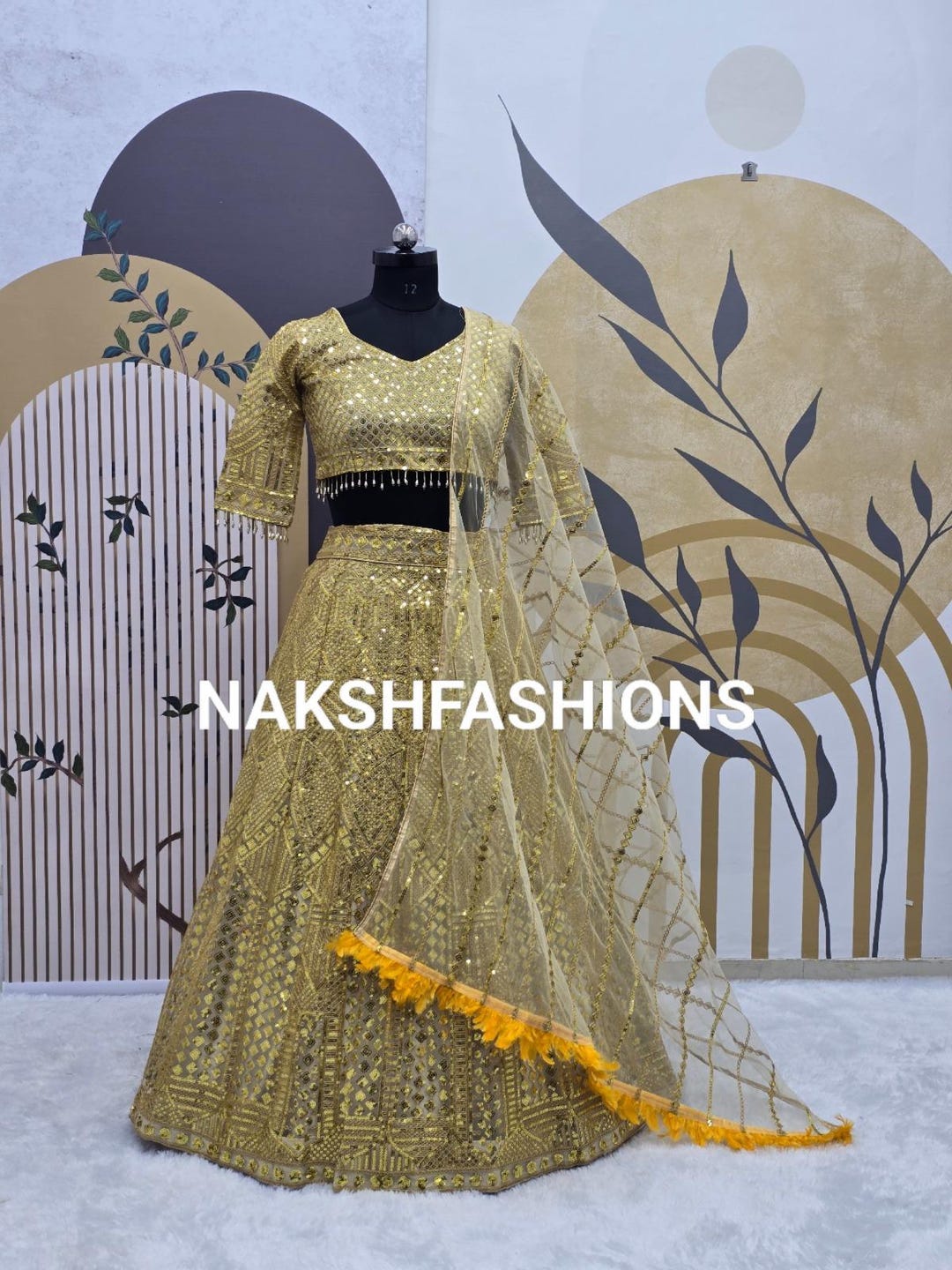 Soft Gold Embroidered Net Lehenga
