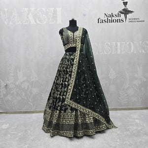 Green Dola Silk Jacquard Lehenga Choli: Embroidered Indian Party Wear