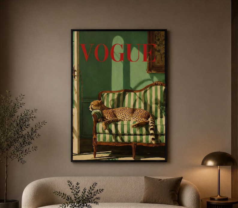 a living room with a large framed poster of a cat on the wall, a sofa, a coffee table, and a lamp.