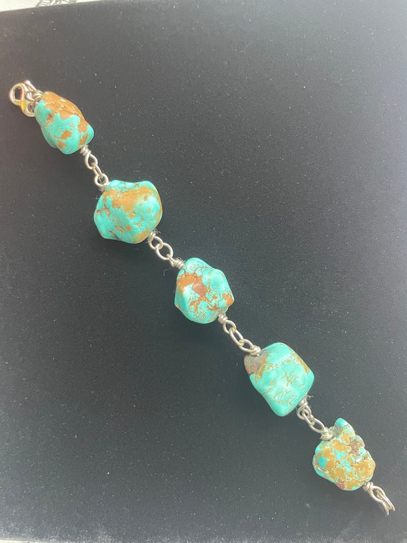 Turquoise, sterling, and 18k gold bracelet.