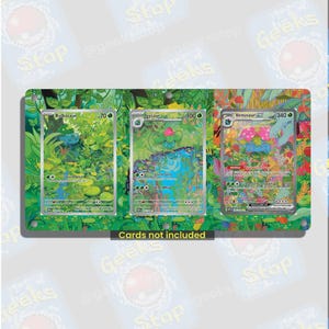 May include: A rectangular display frame featuring three slots for trading cards, decorated with a vibrant jungle illustration. The frame includes the text "Cards not included" in a black box at the bottom centre and has four small circular holes.