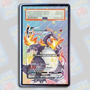 May include: A Pokemon trading card featuring Charizard VMAX from the Shining Fates expansion. The card is graded GEM MT 10 by PSA. The card shows Charizard in a fiery pose with a white background. The card text reads "Claw Slash" and "G-Max Wildfire".