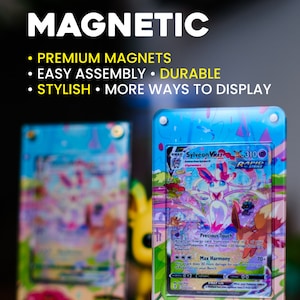 May include: Clear magnetic card holders displaying a Pok&eacute;mon trading card. The card features a Sylveon VMAX character with a pink and white color scheme. The holders are labeled "MAGNETIC" and highlight features like "PREMIUM MAGNETS" and "DURABLE".