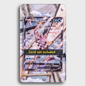 May include: A Pokemon trading card featuring Origin Forme Palkia, a blue and white Pokemon with a silver background. The card is in a protective acrylic case with a silver and white design. The card text reads "Origin Forme Palkia" and "Hydro Break".