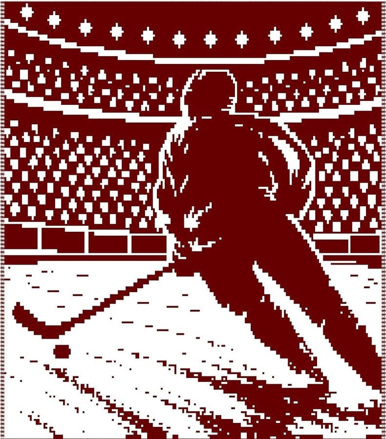 May include: A maroon and white woven blanket featuring a pixelated graphic of a hockey player on the ice. The design depicts the athlete in motion with a hockey stick and puck, set against a stadium background with rows of spectators.