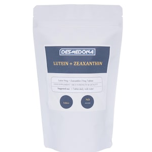 May include: A white pouch with a blue label featuring the text "DESMEDONA" and "LUTEIN + ZEAXANTHIN." The label also includes text about the product's ingredients and suggested use. The pouch contains tablets and is labeled "NO FILLERS."