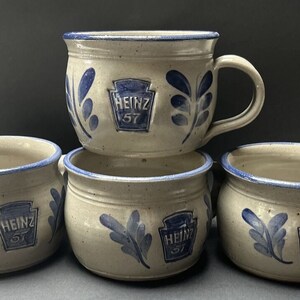 May include: Set of four stoneware soup mugs with blue and white floral designs and the Heinz 57 logo.