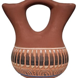 May include: A brown ceramic water jar with a distinctive handle. The jar features a decorative band with vertical and curved patterns in shades of brown, black, and white. A blue band accents the base. The jar is a traditional pottery piece.
