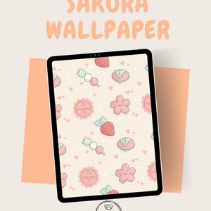 Può includere: Un tablet digitale mostra un design "Sakura Wallpaper". Lo sfondo presenta un motivo ripetuto di fiori di ciliegio rosa, fragole e dolci giapponesi su uno sfondo rosa chiaro. Il logo "Wabisabi Shop" è in basso.