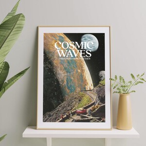 May include: A framed poster with a collage of space imagery, including planets, stars, and a red car driving on a road. The poster has the text "COSMIC WAVES" and "VIBRATIONS FROM THE ETHER" in white letters.