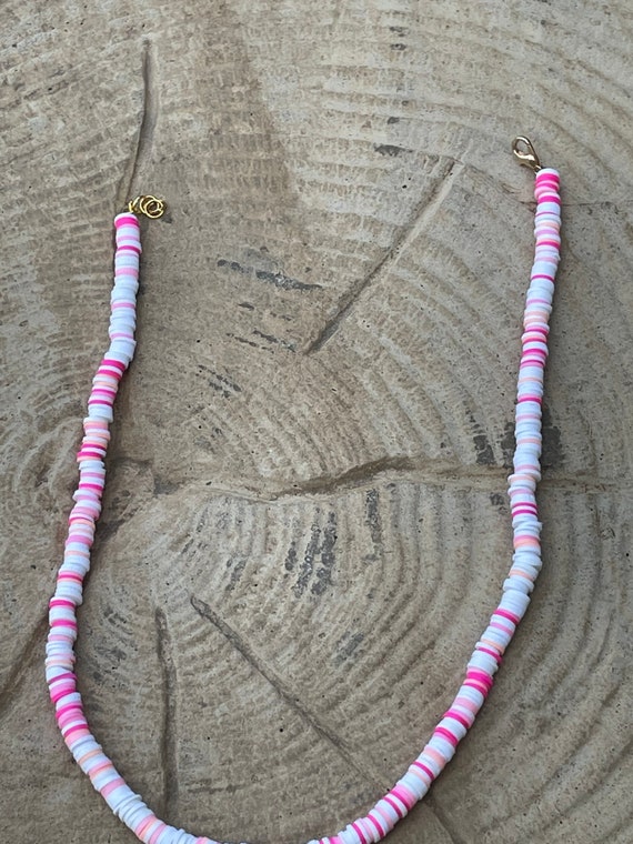 29 inch pink clay bead necklace on black leather double strand