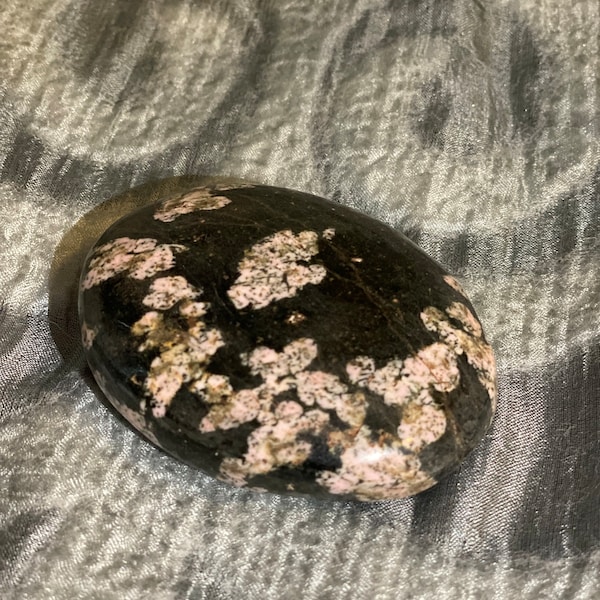 Black Jade with Pink Thulite “flowers” palm stone