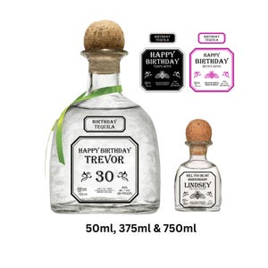 May include: A large 750ml glass tequila bottle with a cork stopper and a green ribbon, featuring a label that reads Happy Birthday Trevor 30. Beside it is a smaller glass bottle with a cork stopper labeled Will You Be My Bridesmaid? Lindsey.
