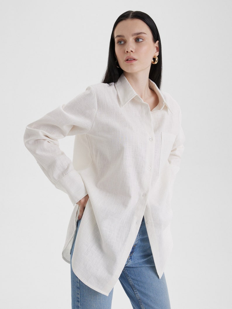 A woman wearing a Women White Linen Oversized Shirt and jeans in summer.