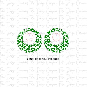 May include: Two green and white leopard print earrings with a 2 inch circumference. The earrings are round and have a hole in the center for hanging.