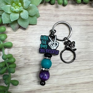 Have the Day You Deserve-sleutelhanger met kralenketting