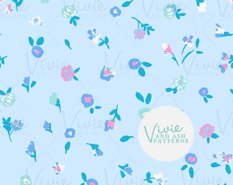 May include: A seamless pattern featuring a light blue background with a repeating design of small pink, blue, and white flowers with green leaves. The pattern is surrounded by a white circle with the text "Vivie and Ash Patterns" in green.