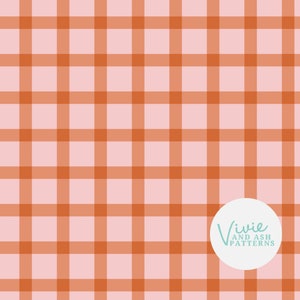 May include: A repeating pattern of intersecting orange lines on a light pink background, creating a grid or plaid design. The design is a simple, geometric pattern. The text "Vivie and Ash Patterns" is in a white circle in the bottom right corner.