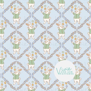 May include: A repeating pattern featuring cartoon bunnies in green sweaters juggling Easter eggs. The bunnies are set against a light blue background with a diamond lattice design and floral accents. The pattern includes the text "Vivie and Ash Patterns".