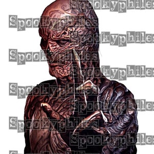 May include: A close-up of a scary, monstrous creature with a grotesque, wrinkled face and a dark, shadowy appearance. The creature is wearing a dark, tattered outfit and has a menacing expression.