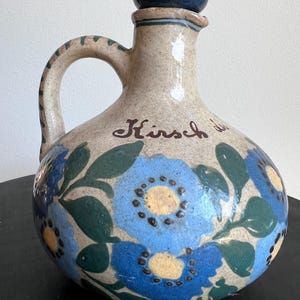 Vintage Kirsch des Vosges pitcher – beige ceramic with blue flowers