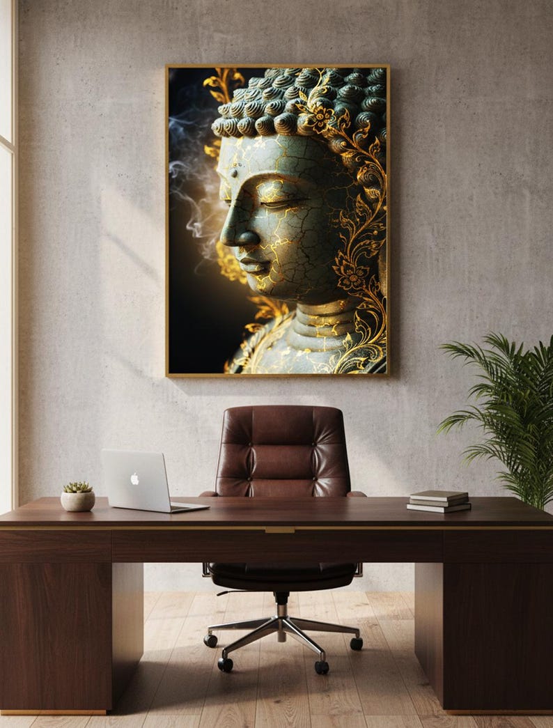 May include: A framed artwork featuring a serene Buddha statue with a teal and gold color scheme. The office setting includes a brown desk, leather chair, laptop, and a small plant, creating a calming atmosphere.