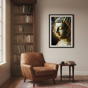 May include: A framed print of a serene Buddha statue. The artwork features a detailed depiction of the Buddha's face with gold accents and a dark background. The print is displayed in a room with a leather armchair, a bookshelf, and a patterned rug.