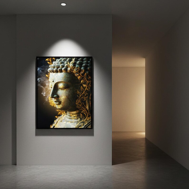 May include: A framed artwork featuring a serene Buddha statue. The statue is depicted in profile, with intricate gold detailing and a weathered, aged appearance. The artwork is displayed on a gray wall in a modern hallway.