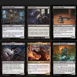 May include: A collection of twelve Magic: The Gathering trading cards arranged in two rows, featuring various fantasy creature illustrations, black and red borders, printed text, and game statistics on each individual rectangular card.