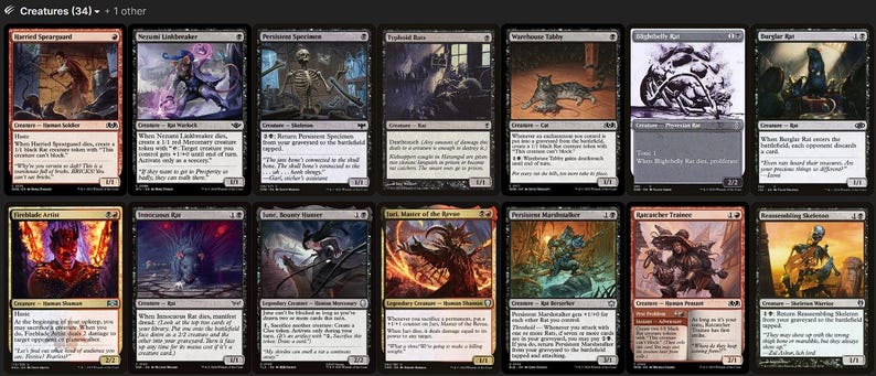 May include: A collection of twelve Magic: The Gathering trading cards arranged in two rows, featuring various fantasy creature illustrations, black and red borders, printed text, and game statistics on each individual rectangular card.