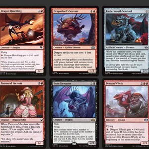 May include: A selection of Magic: The Gathering trading cards, showcasing diverse creatures and spells. The cards feature vibrant illustrations of dragons, warriors, and fantasy settings, with text providing game rules and card titles.