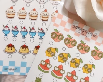May include: Two sticker sheets with dessert and fruit illustrations. One sheet has desserts like parfaits and puddings, with the text "Cute Desserts challenge". The other sheet has fruits like peaches, lemons, watermelons, and pineapples, with the text "Summer Fruit challenge".