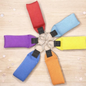 May include: A set of three ceramic nesting bowls in graduating sizes. The bowls feature a speckled, matte finish in shades of cream, beige, and brown. The largest bowl measures approximately 8 inches in diameter.