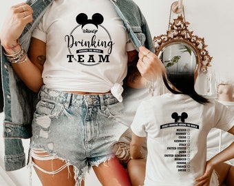 May include: White t-shirt with a black Mickey Mouse head and the text "DISNEY Drinking Around The World TEAM". The back of the shirt has a list of countries with checkboxes next to them.