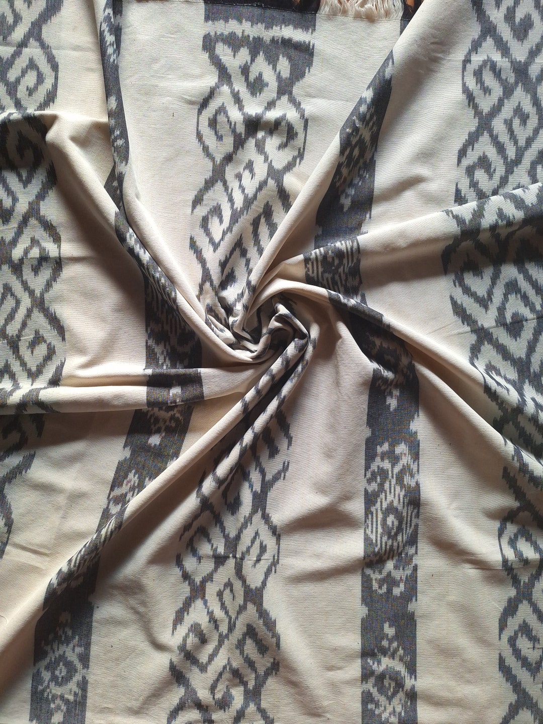 Experience The Artistry Of Ikat Pattern With Our White Hand Woven Experience The Artistry Of Ikat Pattern With Our White Hand Woven