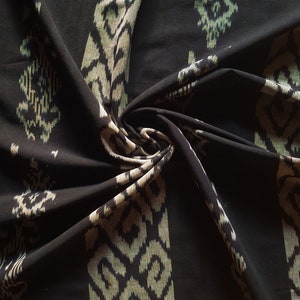 black Ikat pattern Hand Woven Cotton decor fabric throw blanket by local artisans from indonesia