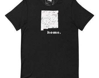 May include: Black t-shirt with a white outline of the state of New Mexico and the word "home." printed below.