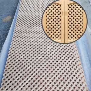 May include: A large, light-colored wooden lattice panel with a repeating diagonal grid pattern. A circular inset shows a close-up of a small wooden cabinet door with a similar lattice design. The wood has a natural, unfinished appearance.