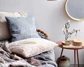 Round mirror made of glass and rattan in brown